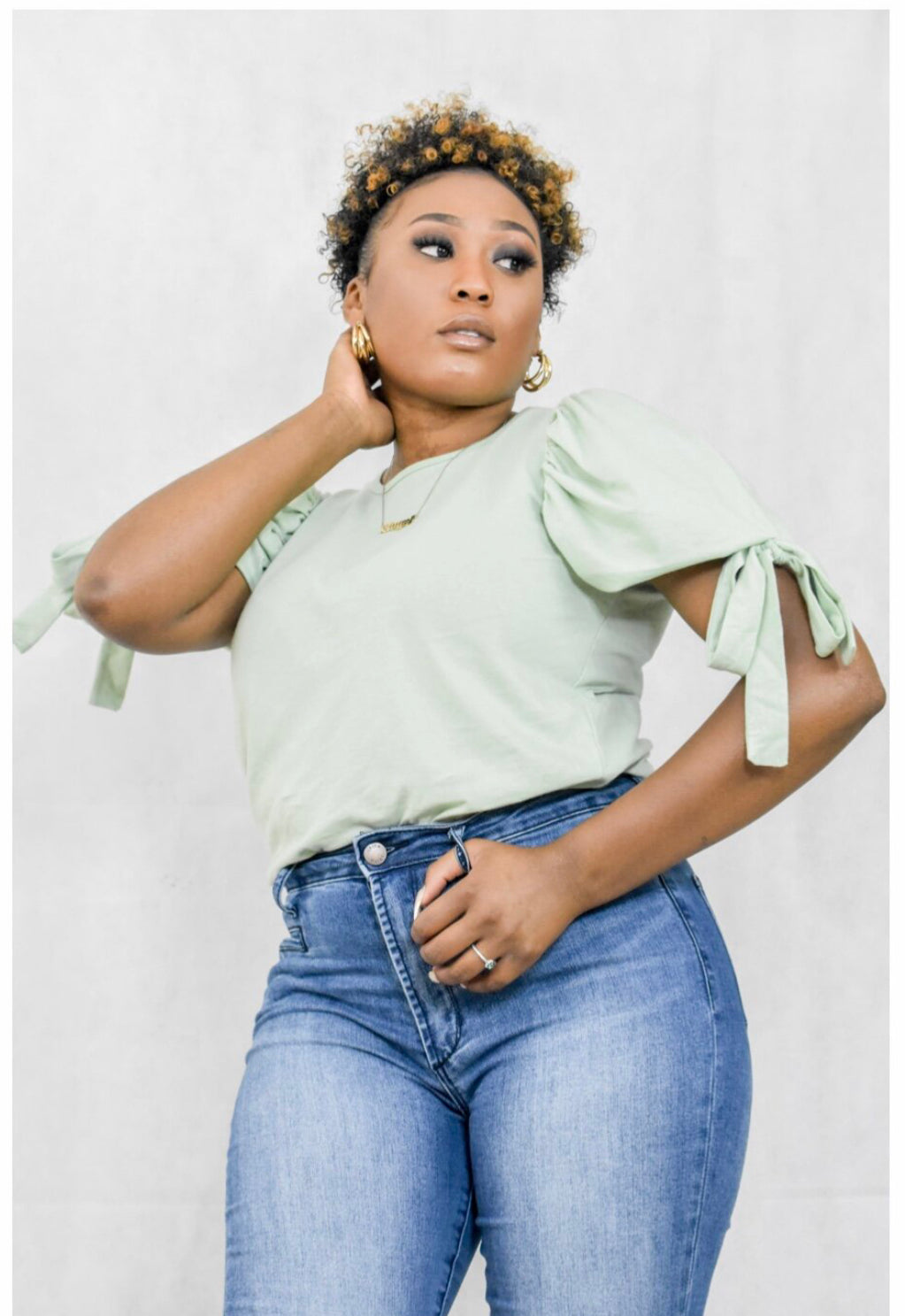 sage green shirt with puff sleeve and tie