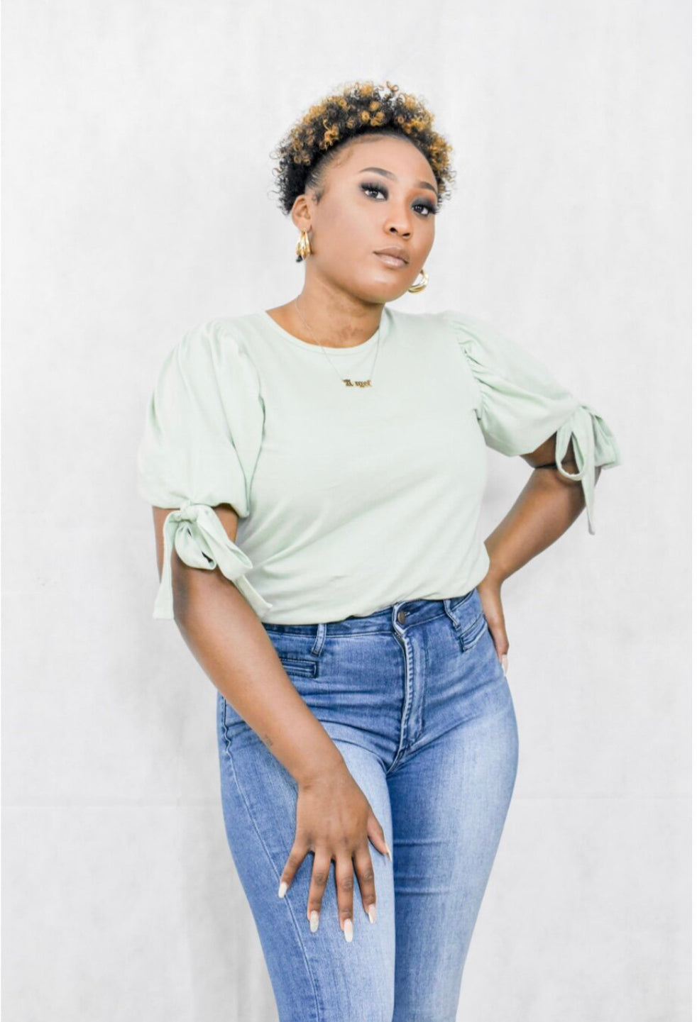 sage green shirt with puff sleeve and tie