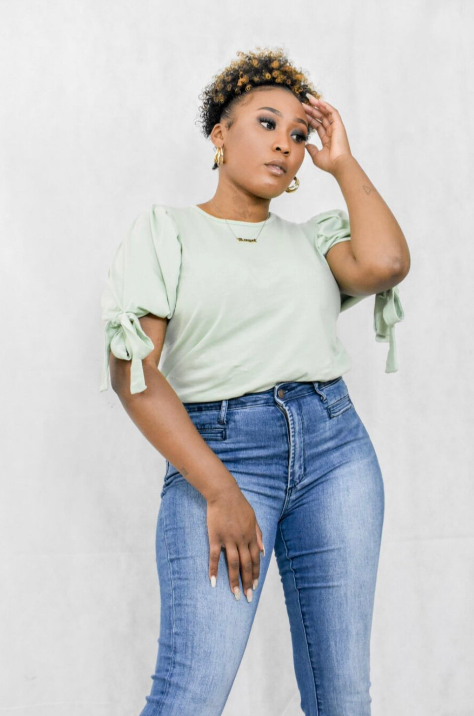 sage green shirt with puff sleeve and tie