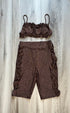 A brown, sparkly, lycra/spandex dance dress pants with a V-neck top, laid out flat on a wooden surface.