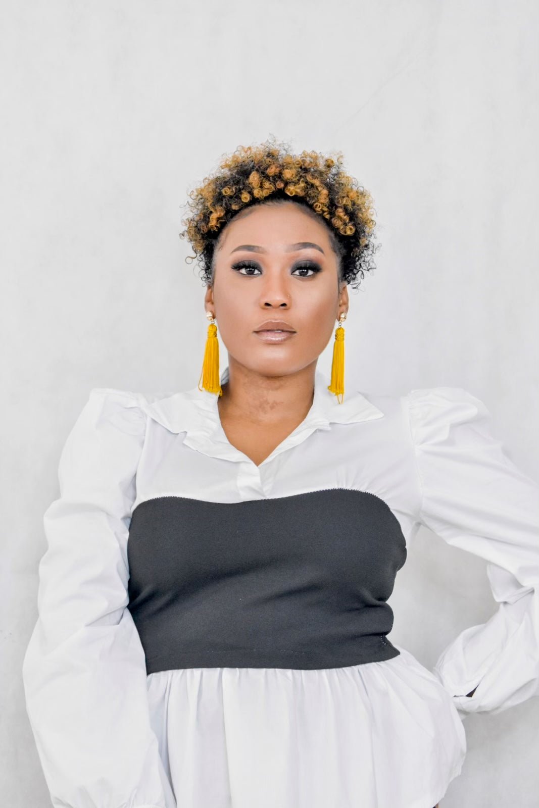 long sleeve color top with puff sleeves and black corset top
